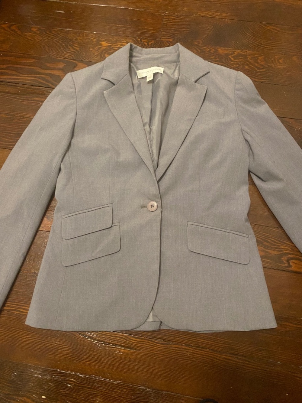 New York and Company grey blazer with asymmetrical pocket detailing